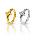 Gold and silver rings with small diamonds on a white background