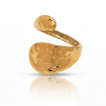 Gold ring with a textured design on a white background