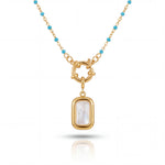 Gold necklace with a pendant on a white background