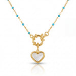 Gold necklace with a heart-shaped pendant on a white background