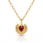 Gold necklace with a heart-shaped pendant on a white background