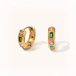 Pair of gold hoop earrings with baguette green, pear pink, round white, and blue stones arranged in a vertical line.