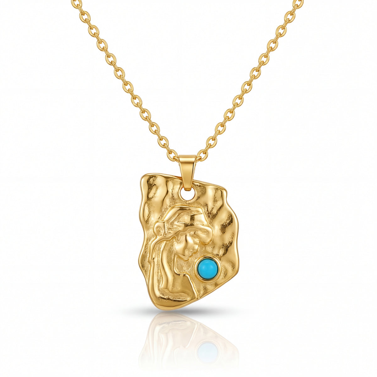 Gold pendant with a turquoise stone on a gold chain against a white background