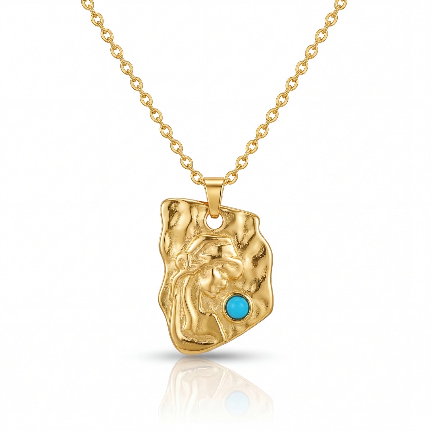 Gold pendant with a turquoise stone on a gold chain against a white background