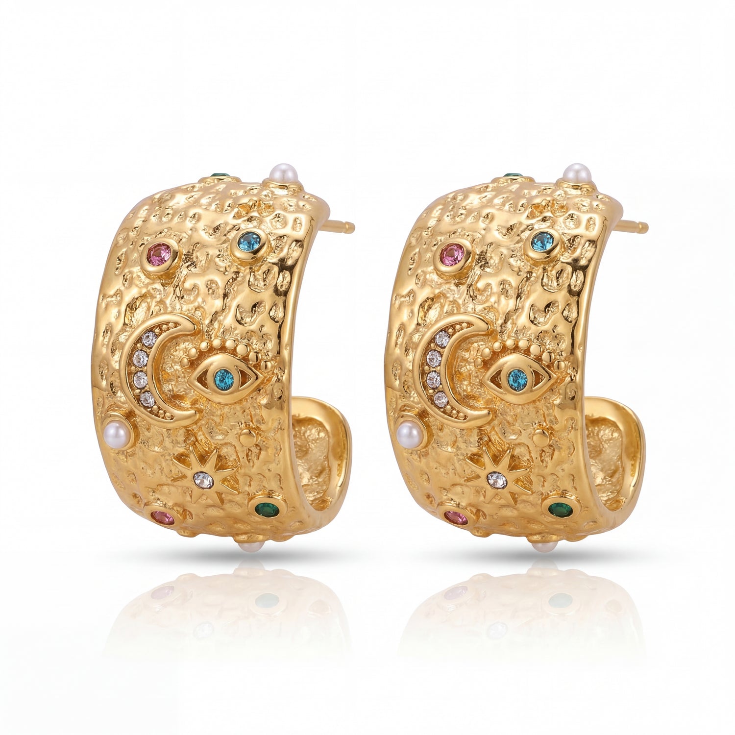 Gold hoop earrings with intricate designs and colorful gemstones on a white background