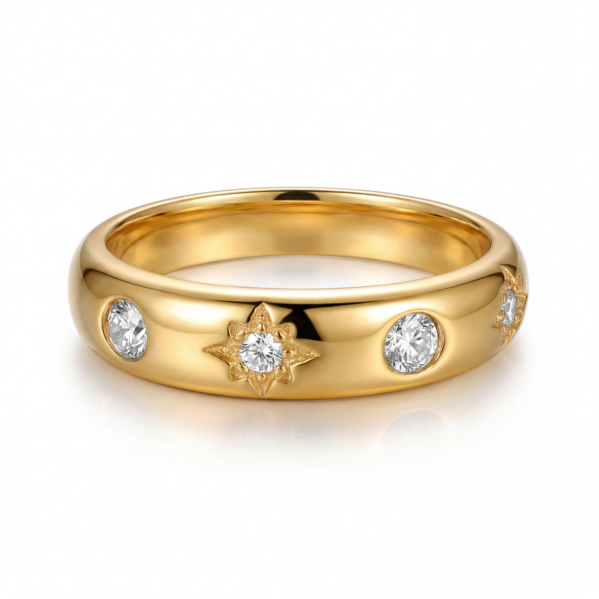 Gold ring with diamond accents on a white background