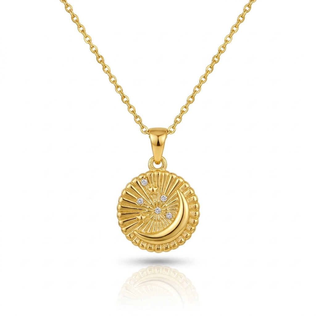 Gold necklace with a round pendant on a white background
