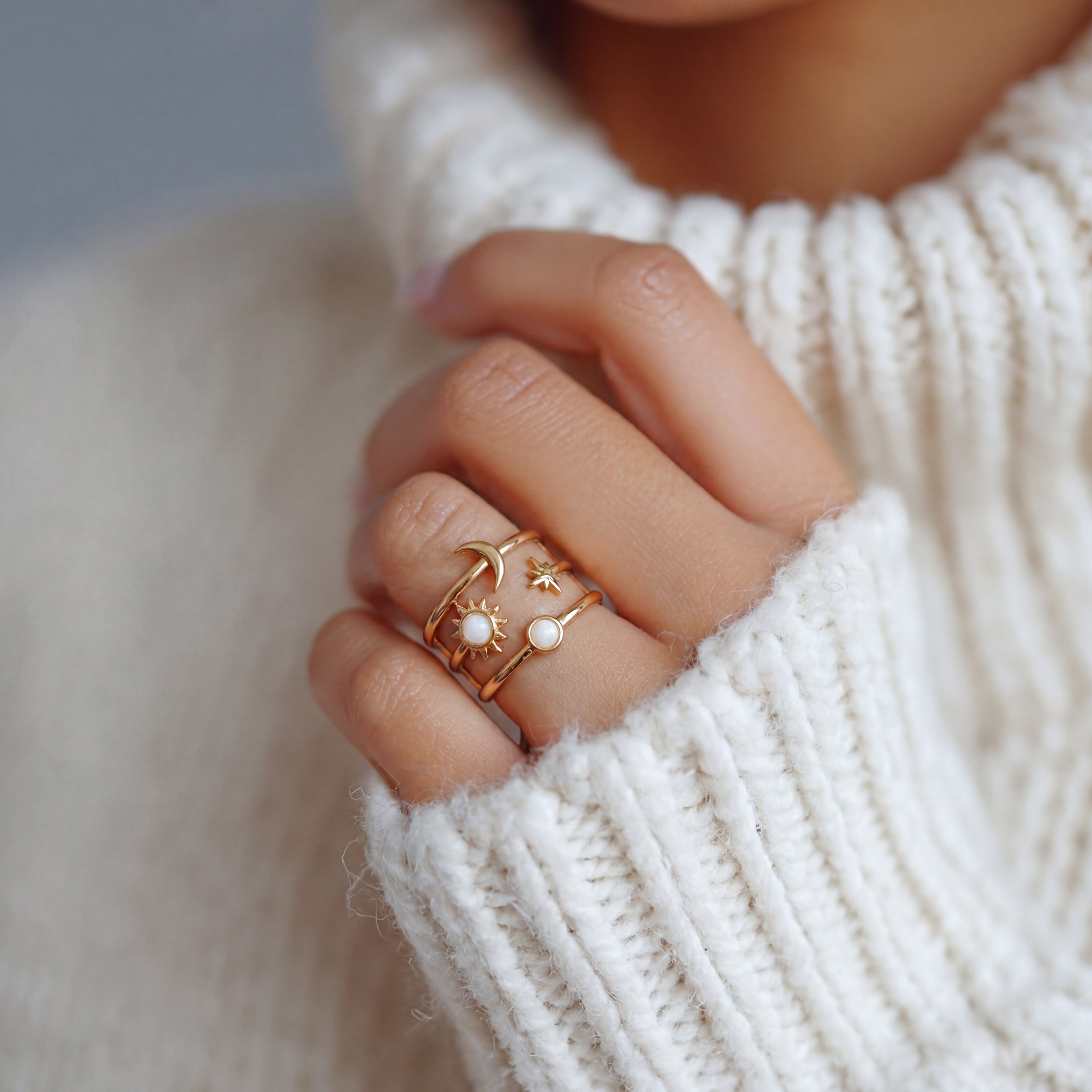 Gold sun and moon adjustable ring with pearl accents worn on finger, waterproof stainless steel celestial jewelry