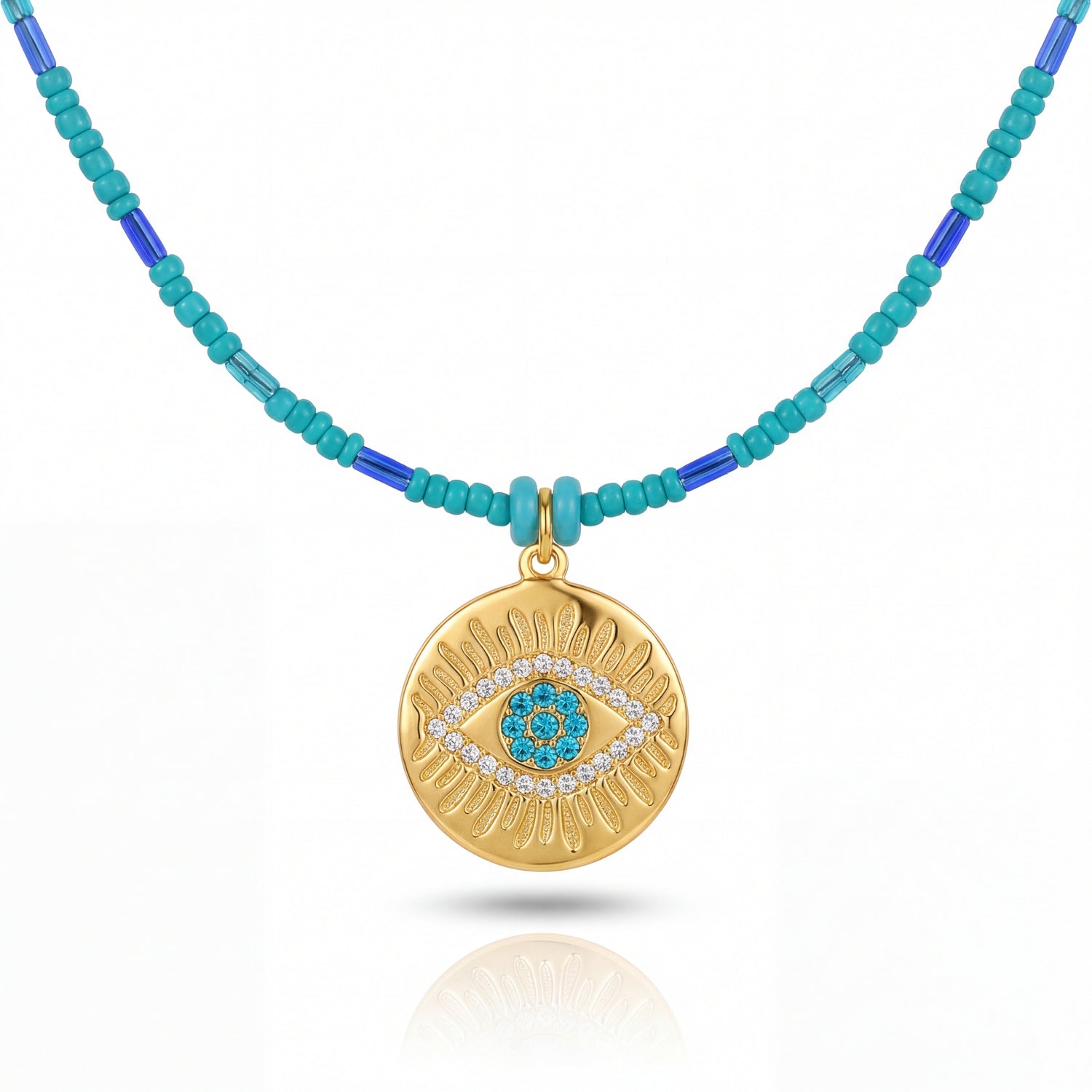 Necklace with gold pendant and turquoise beads on a white background