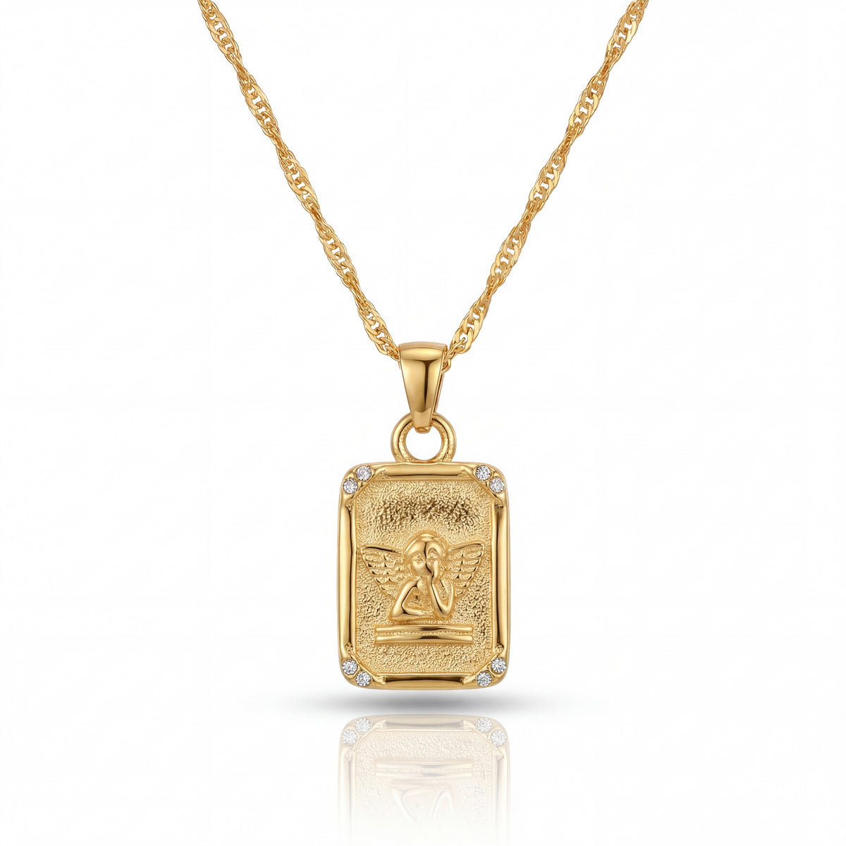 Gold pendant necklace with a detailed design on a white background