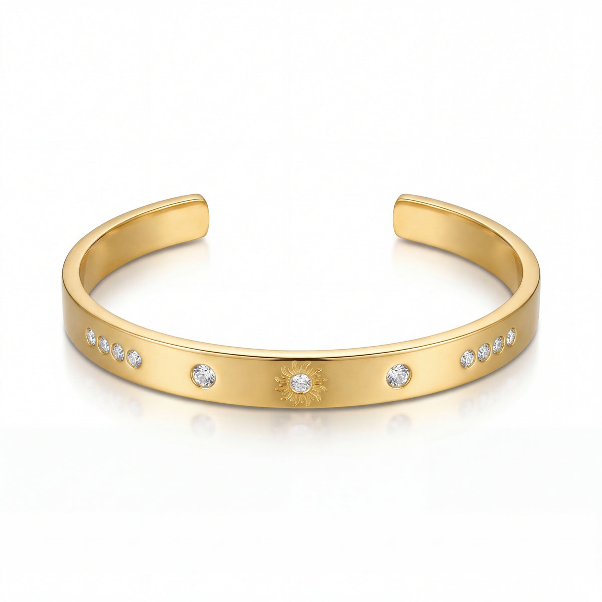 Gold bracelet with embedded stones on a white background