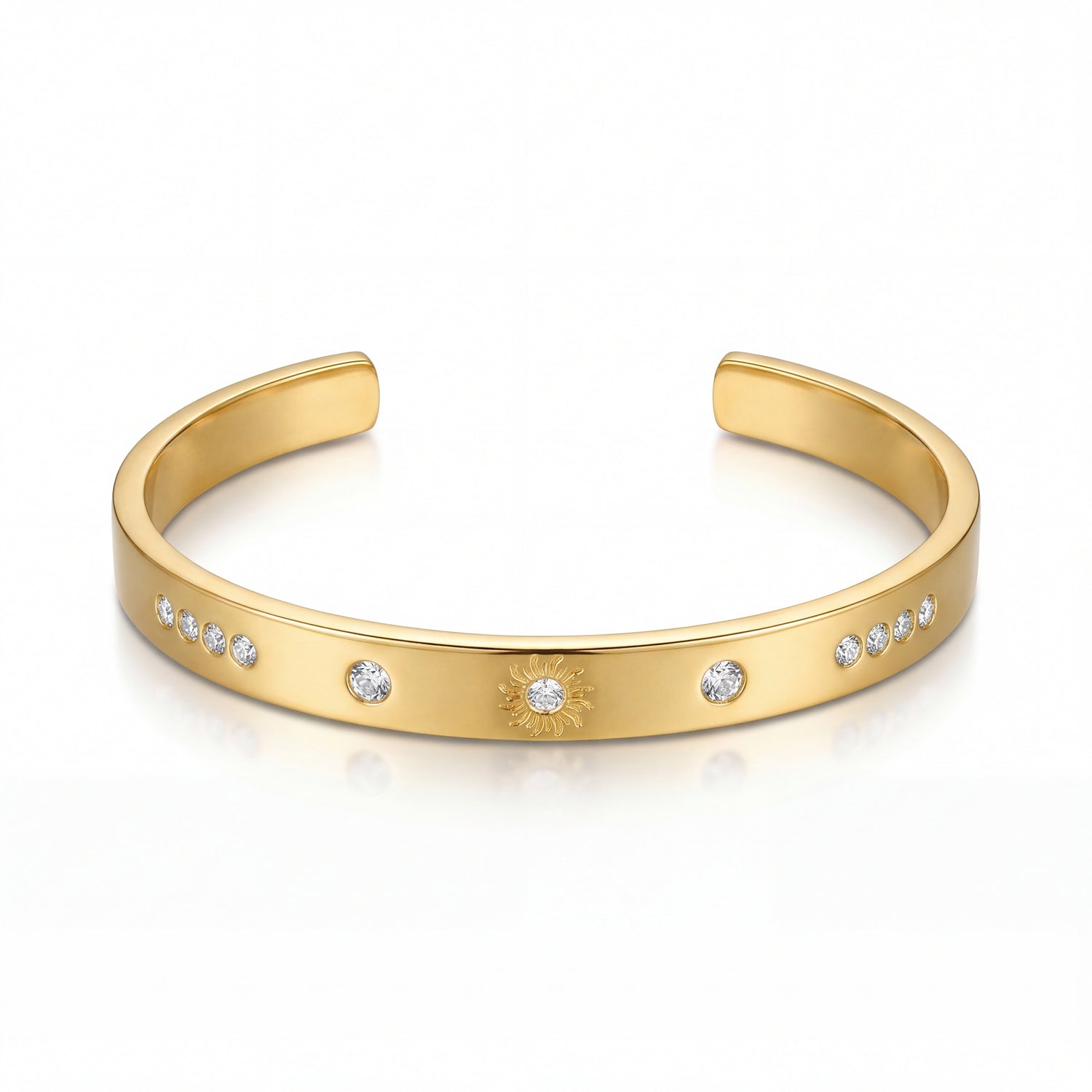 Gold bracelet with embedded stones on a white background