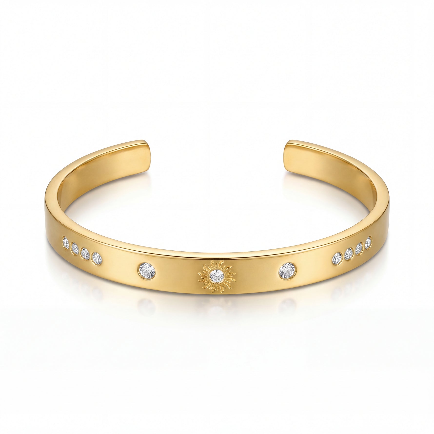Gold bracelet with embedded stones on a white background