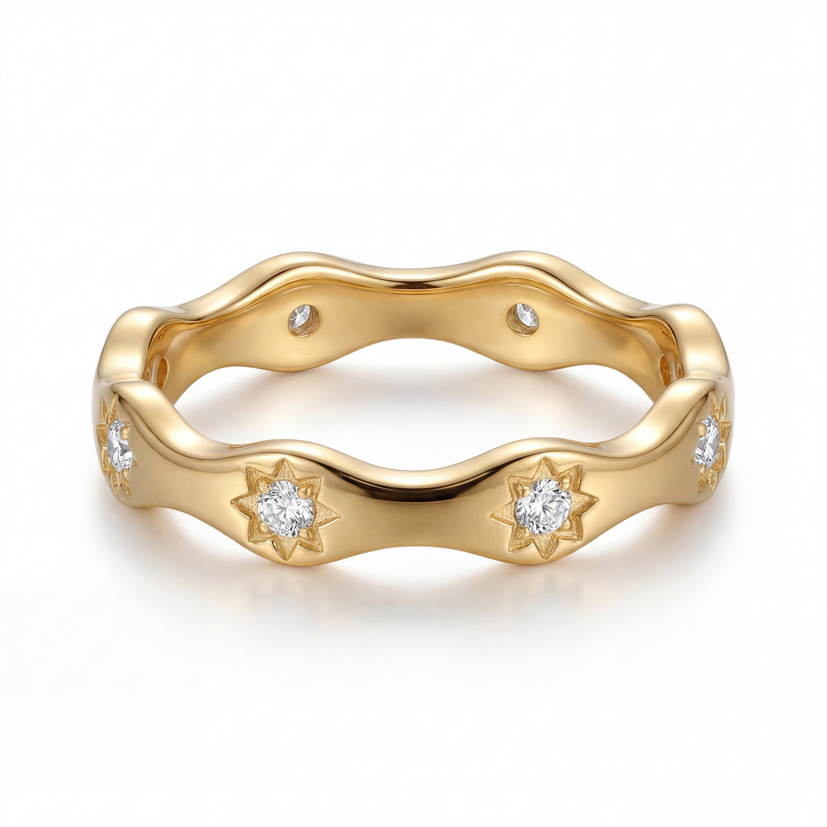Gold ring with diamond accents on a white background