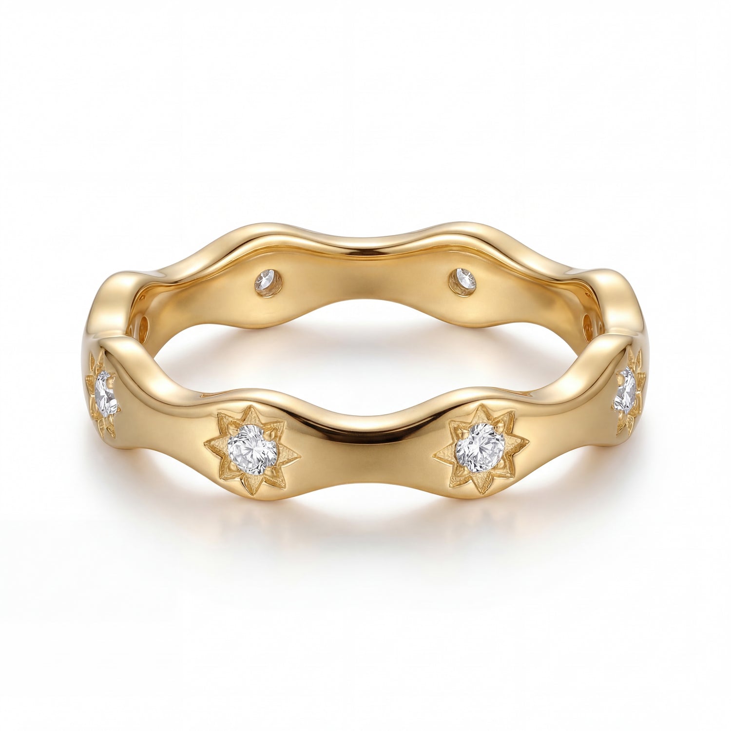 Gold ring with diamond accents on a white background