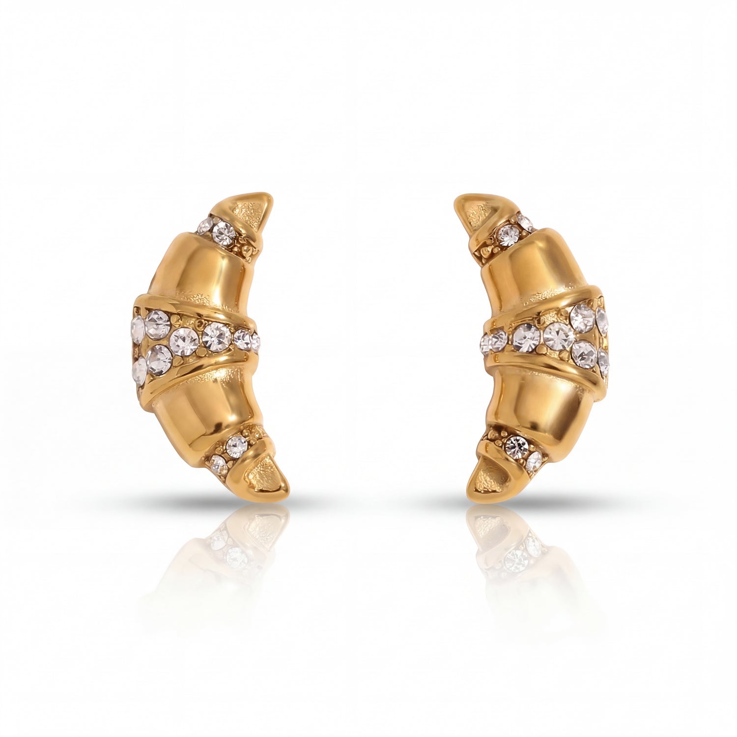 Gold earrings with diamond accents on a white background