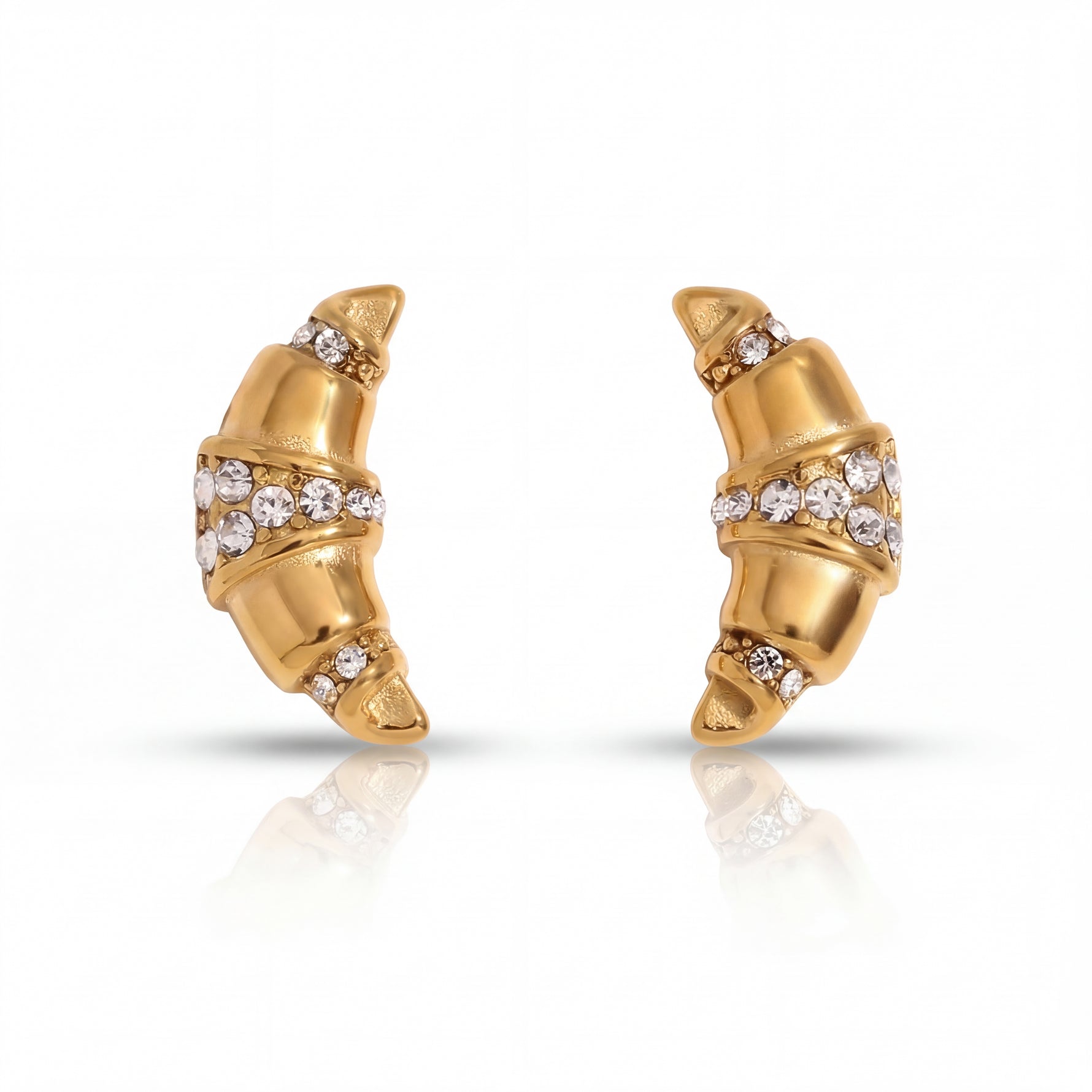 Gold earrings with diamond accents on a white background