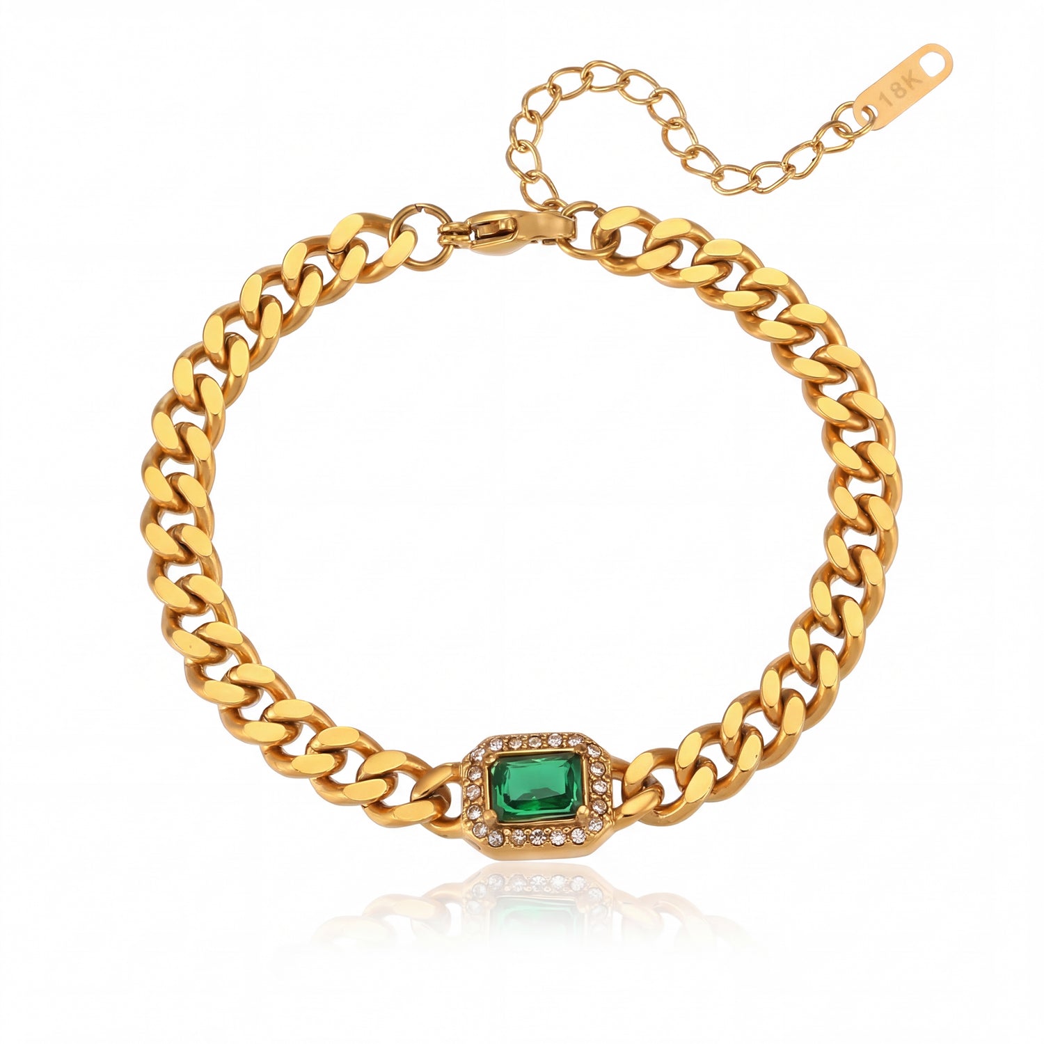 Gold chain bracelet with a green gemstone on a white background