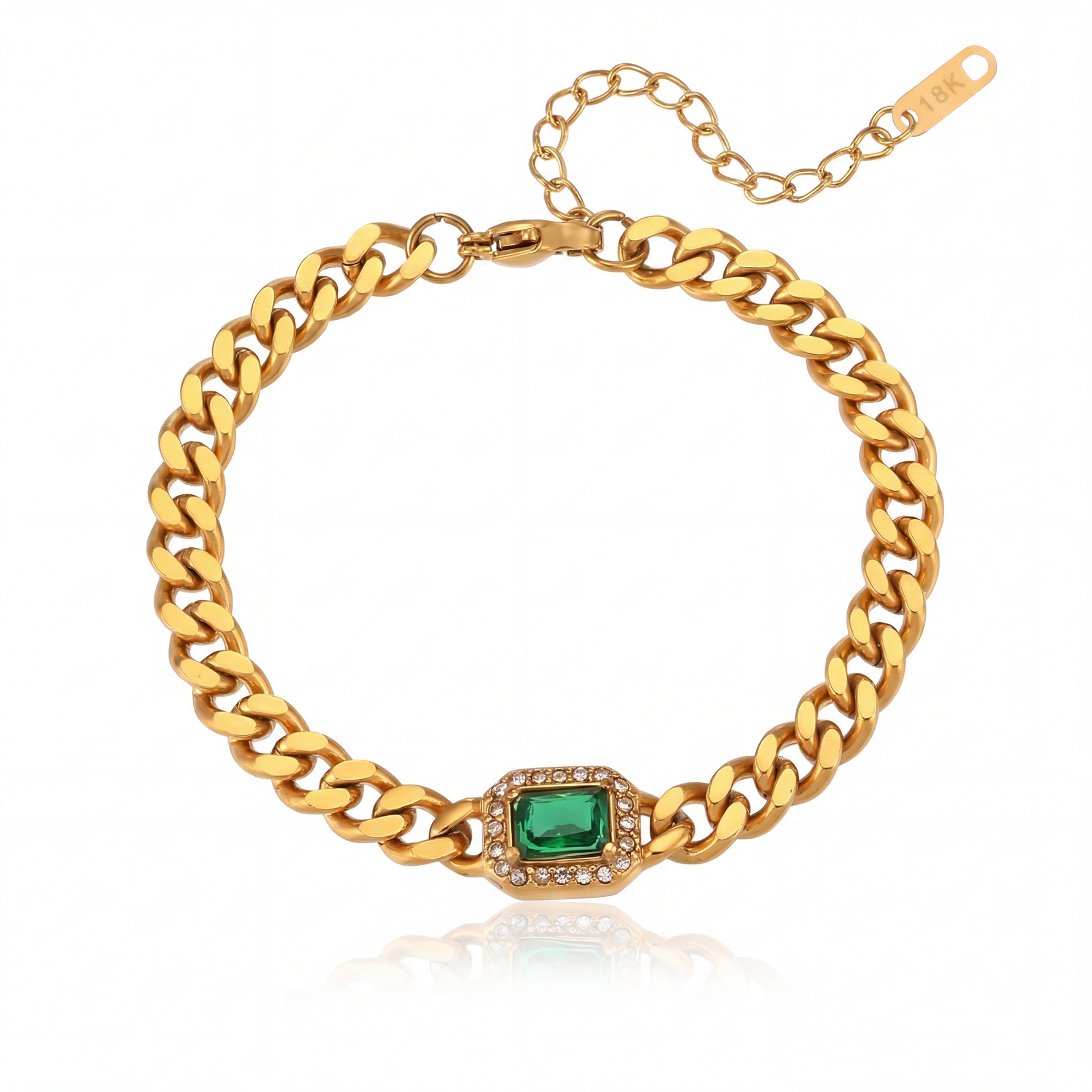 Gold chain bracelet with a green gemstone on a white background