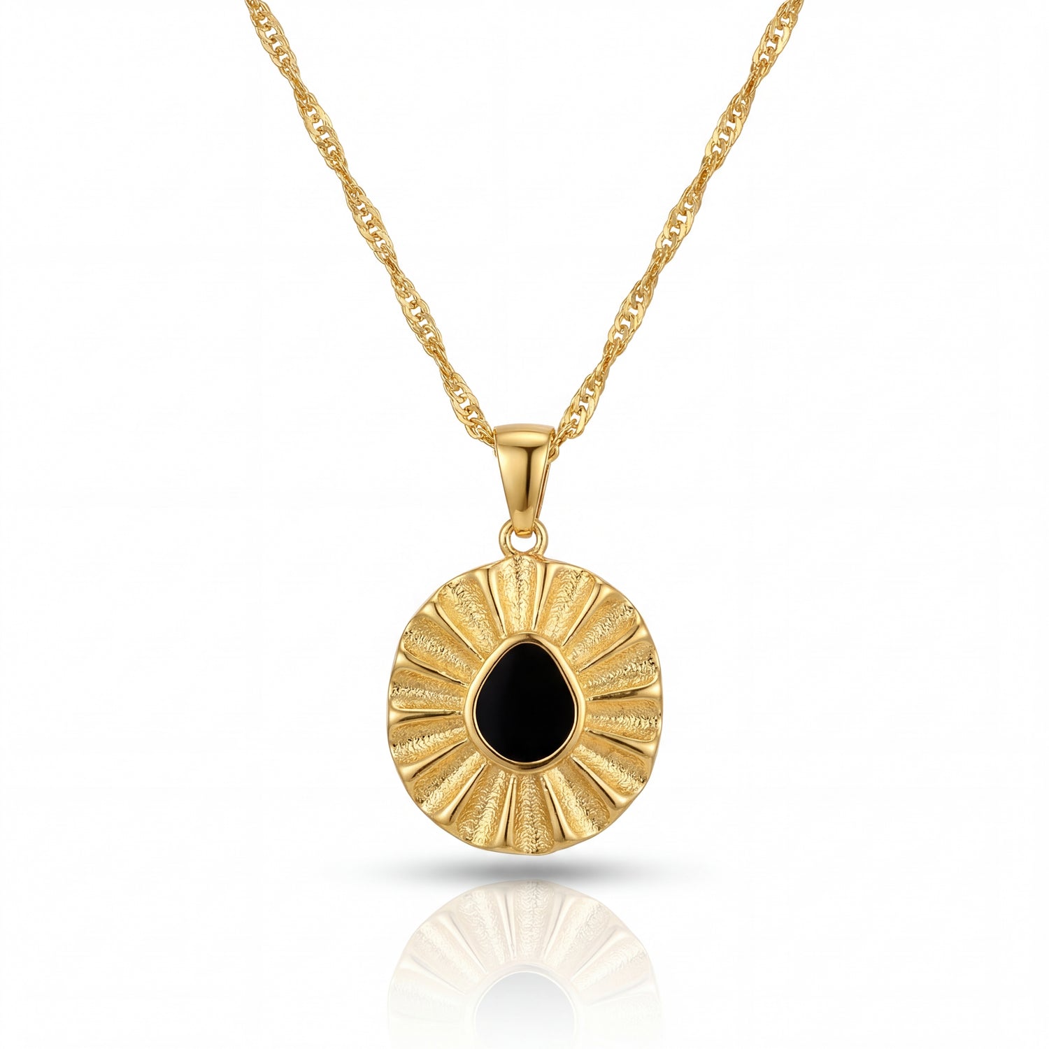 Gold necklace with a round pendant featuring a black stone on a white background
