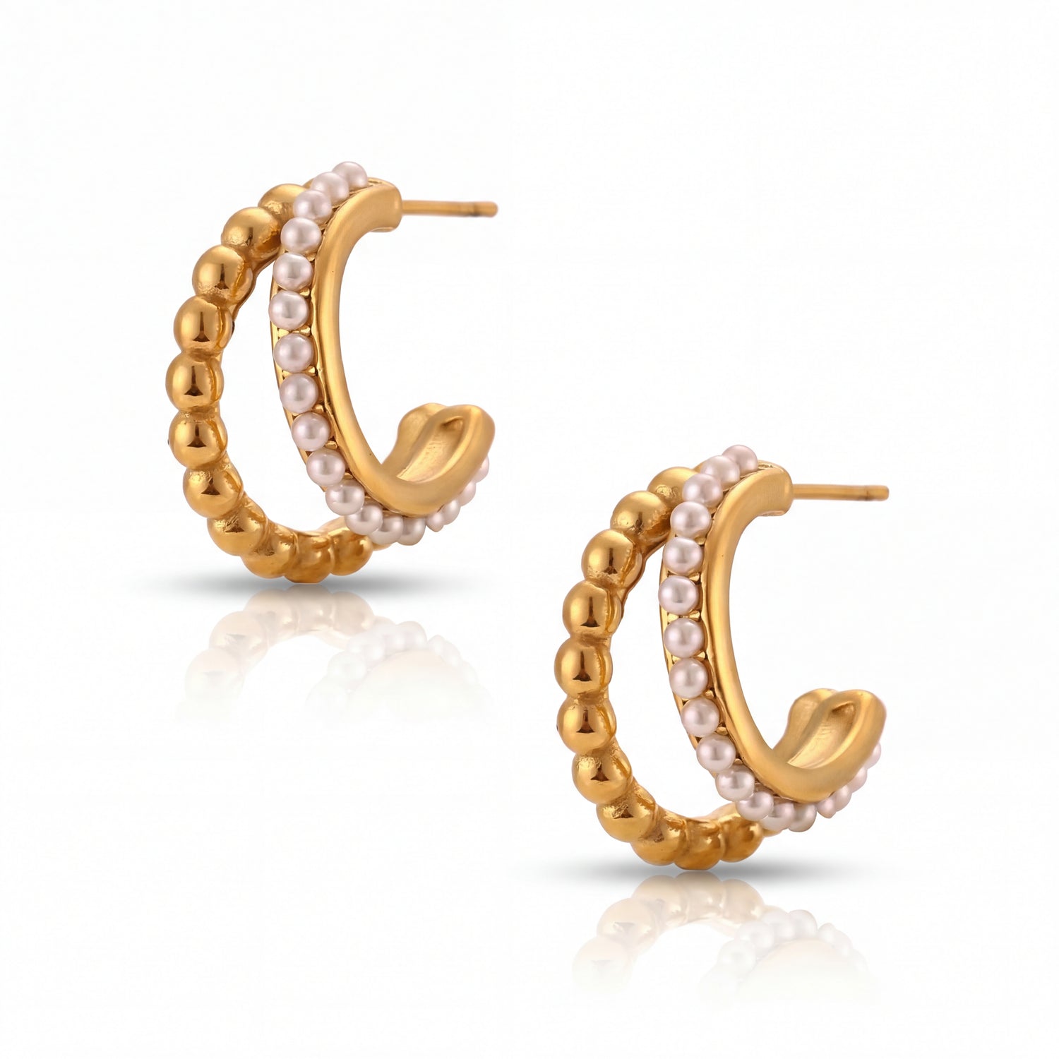 Gold hoop earrings with pearl accents on a white background
