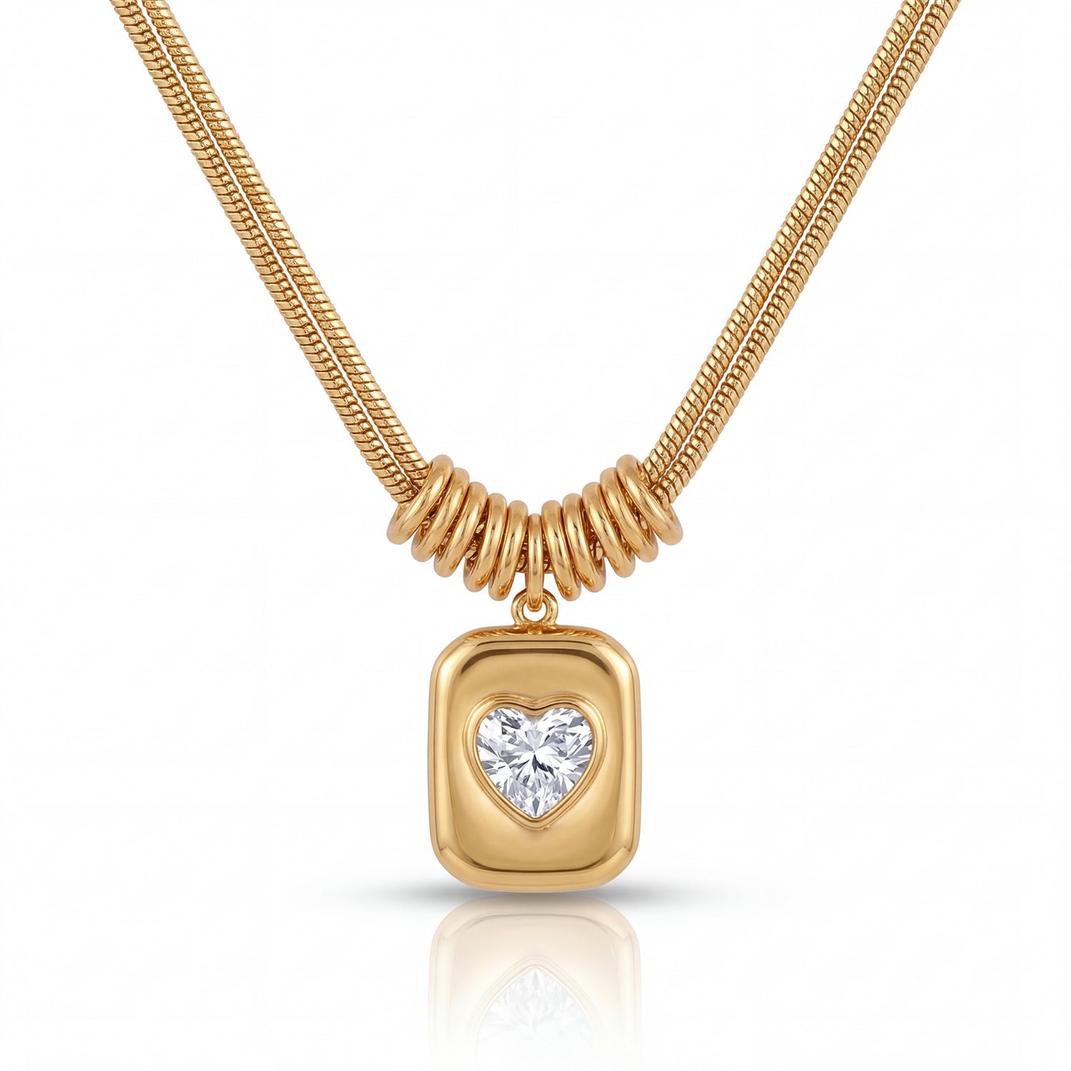 Gold necklace with a heart-shaped diamond pendant on a white background