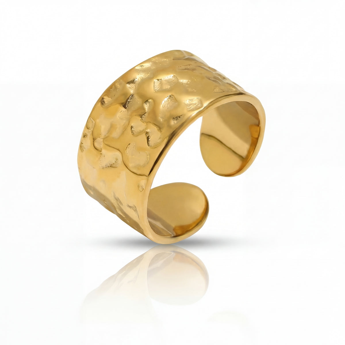 Gold textured ring on a white background