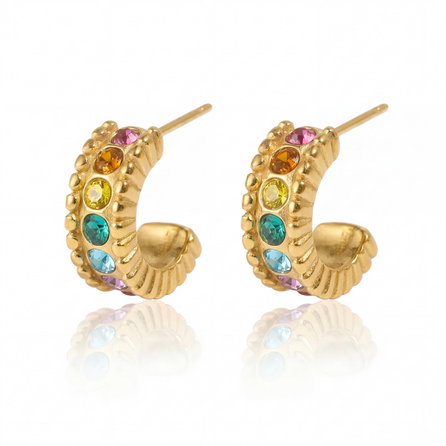 Gold hoop earrings with colorful gemstones on a white background