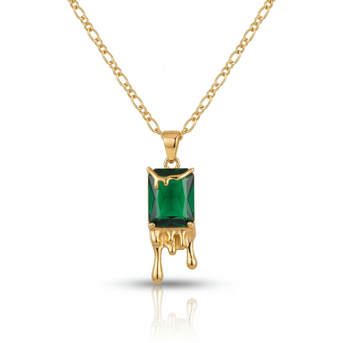 Gold necklace with a green gemstone pendant on a white background