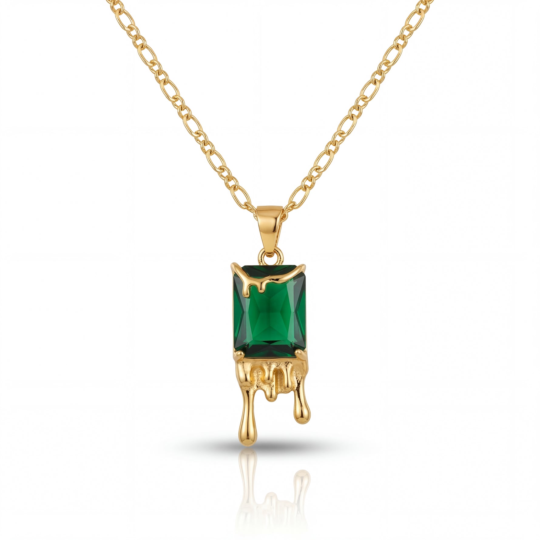 Gold necklace with a green gemstone pendant on a white background