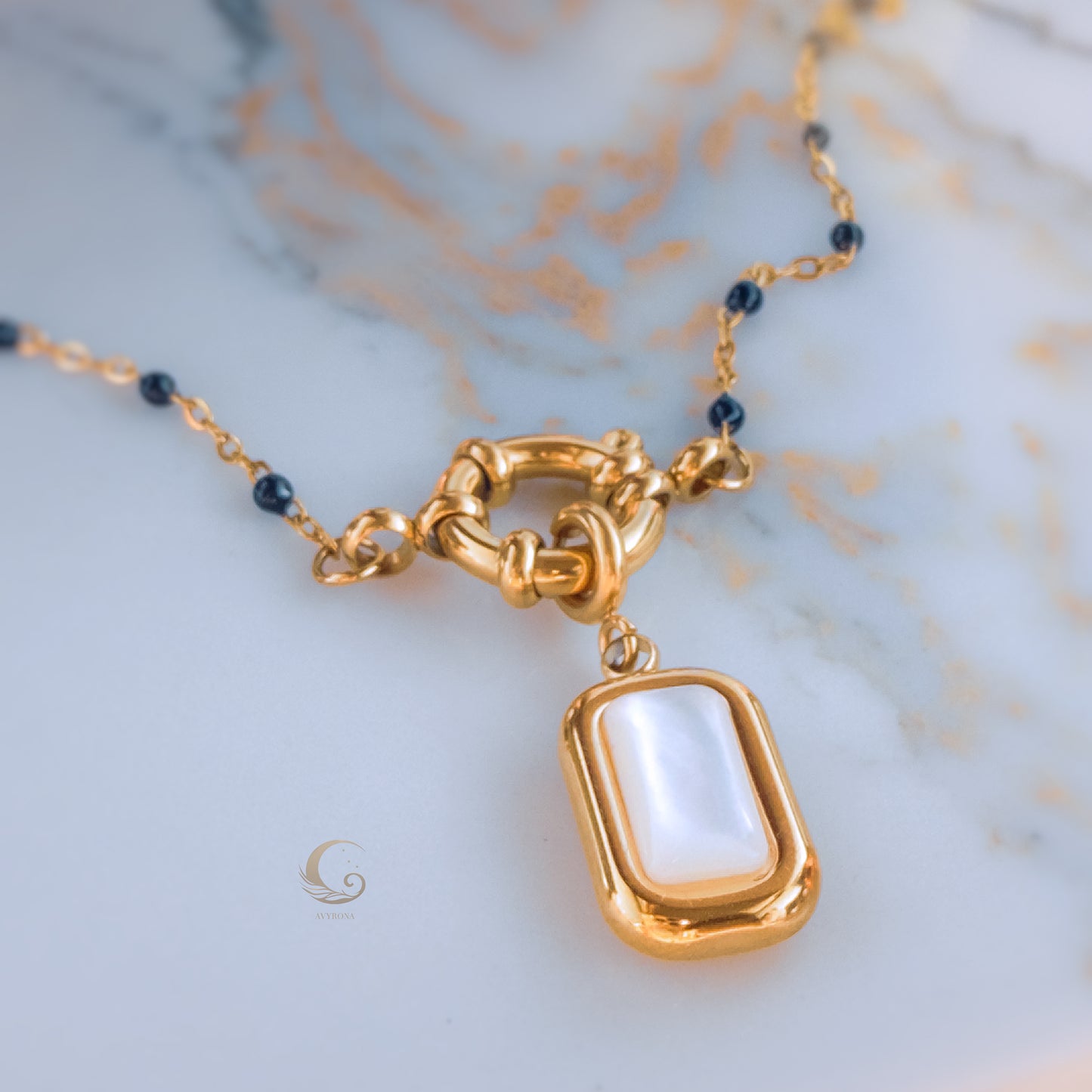 Nerina – Deep Blue Beaded Necklace with Mother of Pearl Pendant.