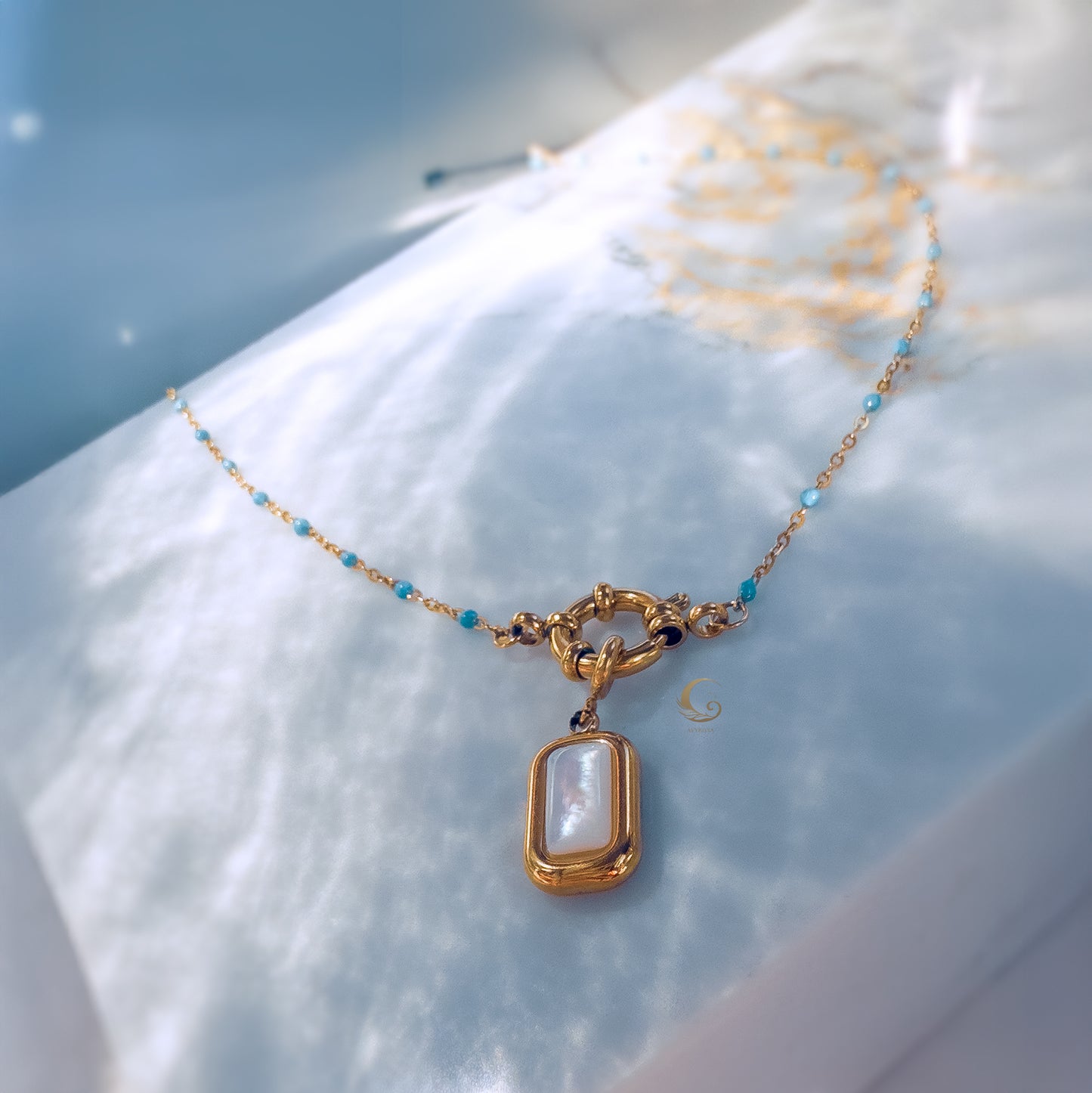 Liora– Sky Blue Beaded Necklace with Mother of Pearl Pendant.