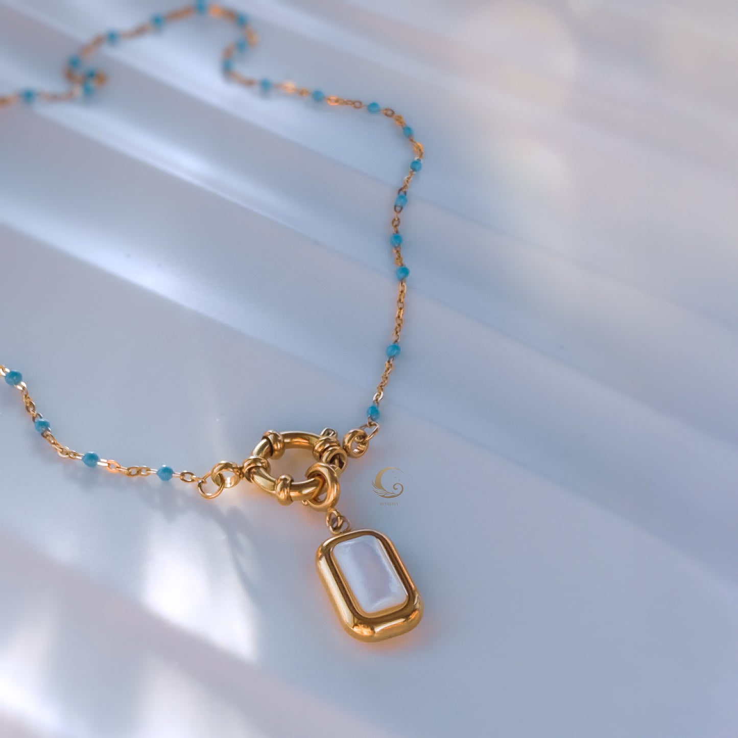 Liora– Sky Blue Beaded Necklace with Mother of Pearl Pendant.