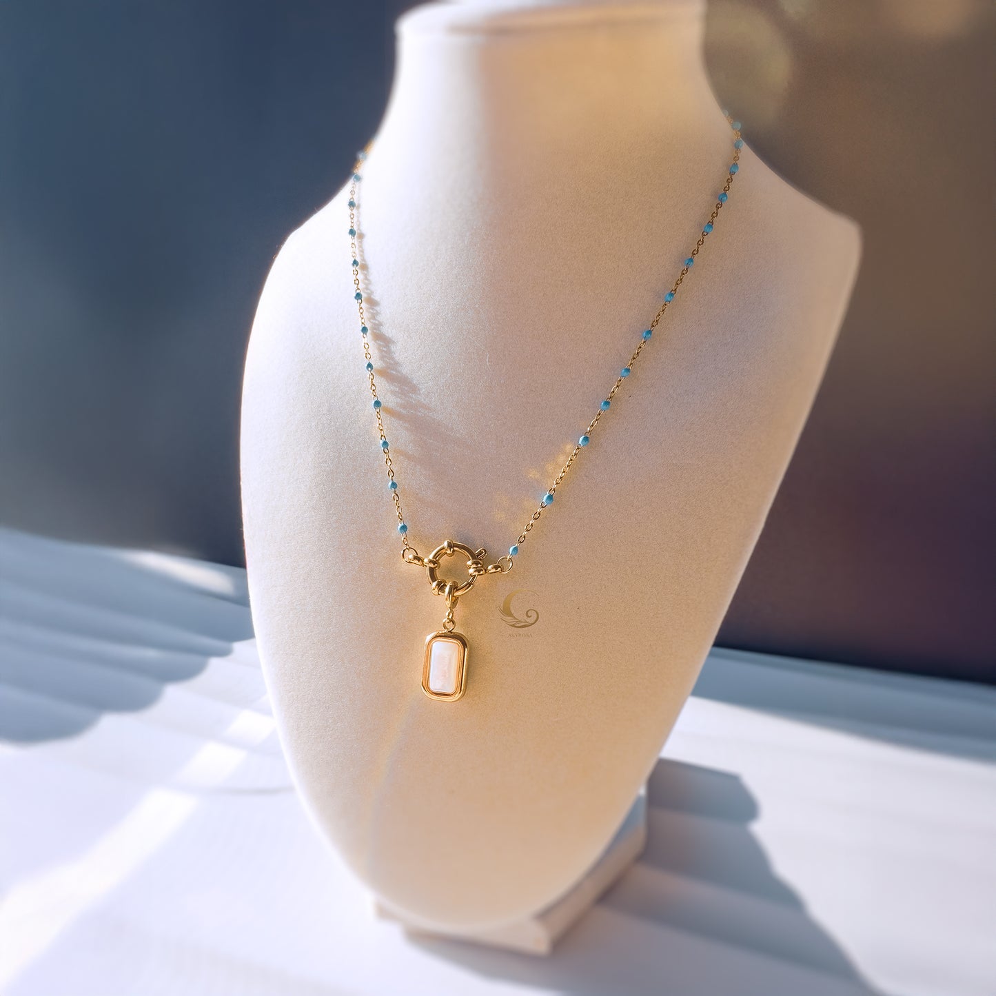 Liora– Sky Blue Beaded Necklace with Mother of Pearl Pendant.