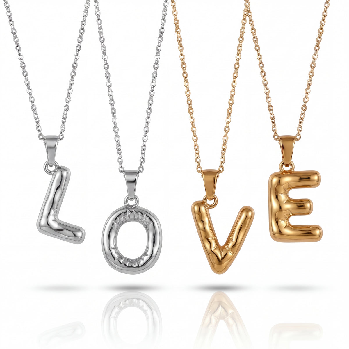 Four gold and silver necklaces with 'LOVE' pendants on a white background