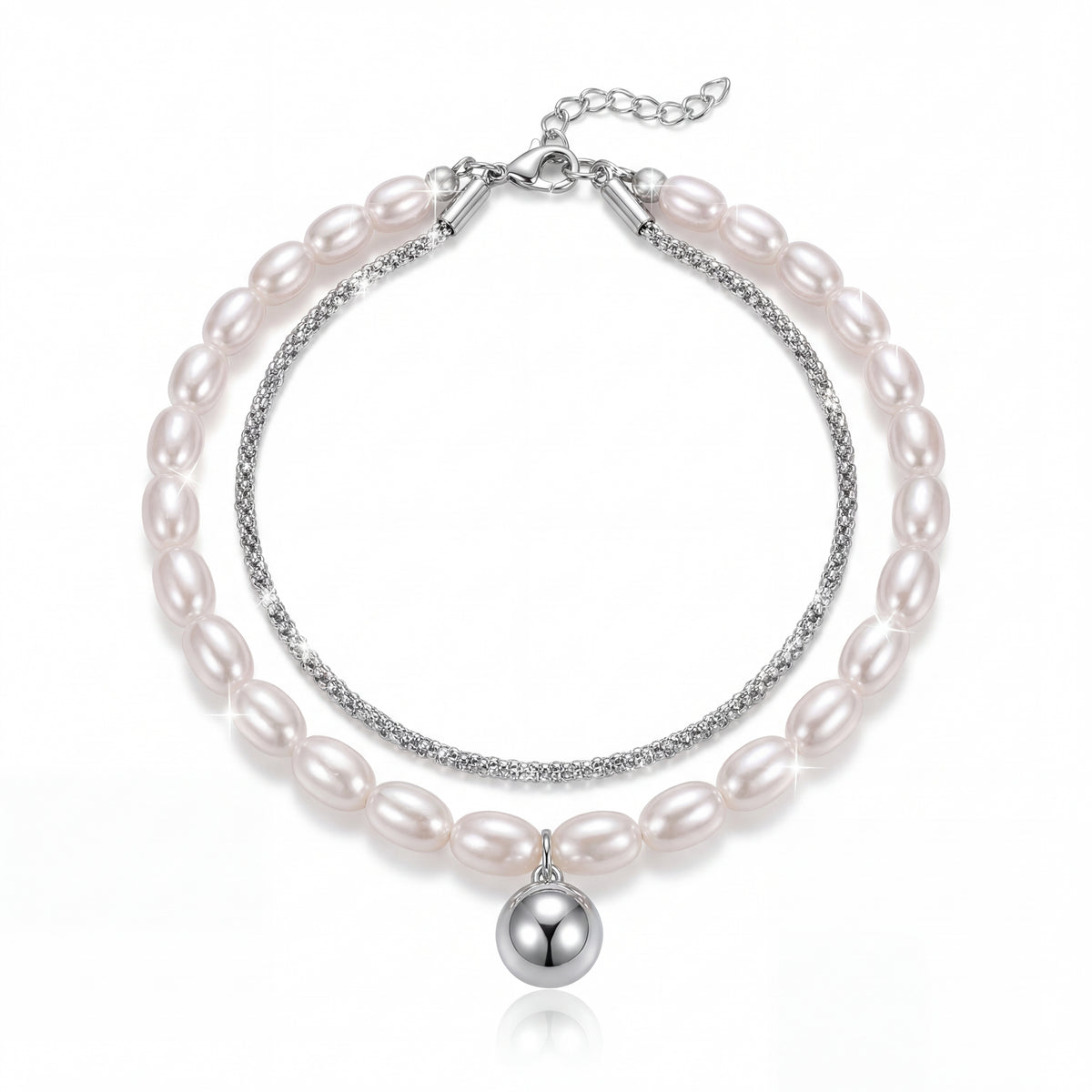 Pearl bracelet with silver accents on a white background