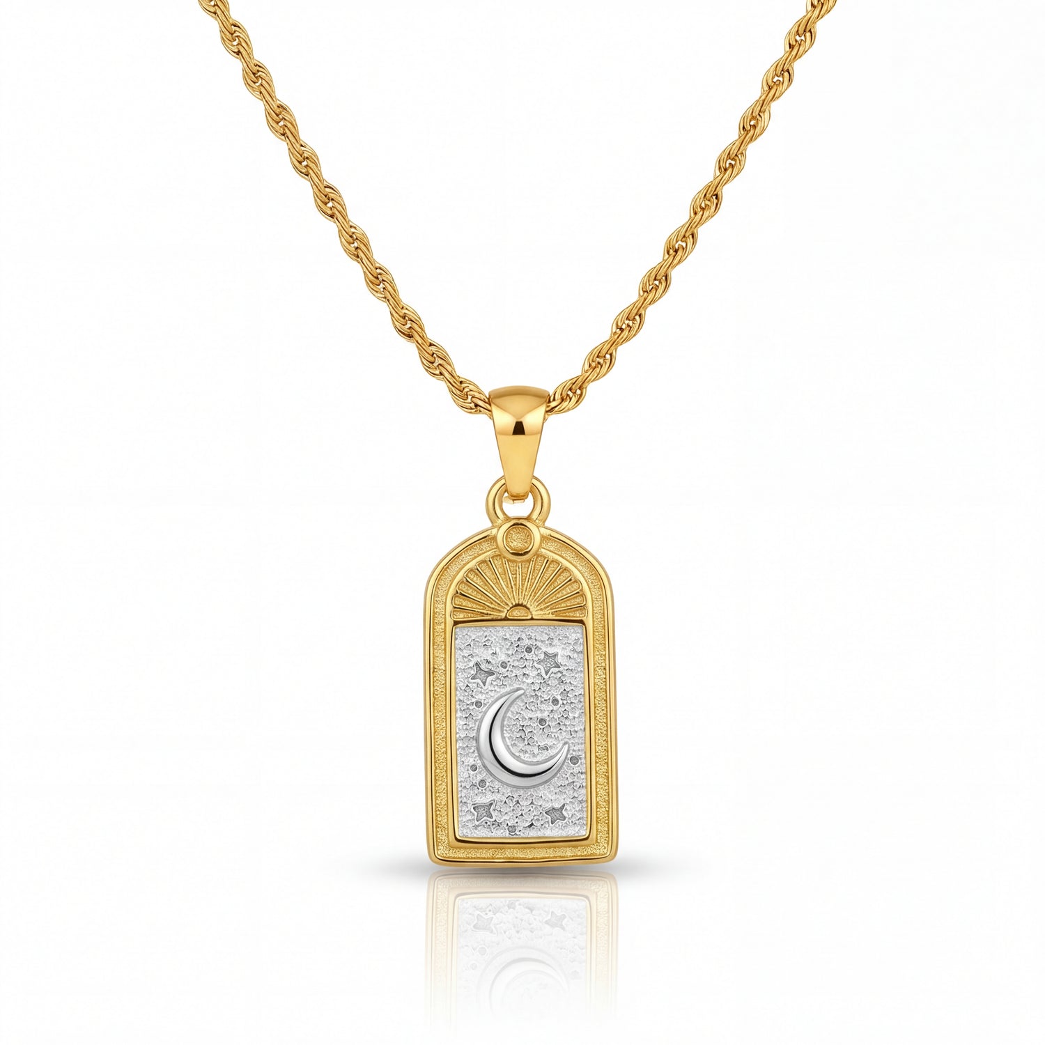 Gold necklace with a pendant featuring a moon design on a white background