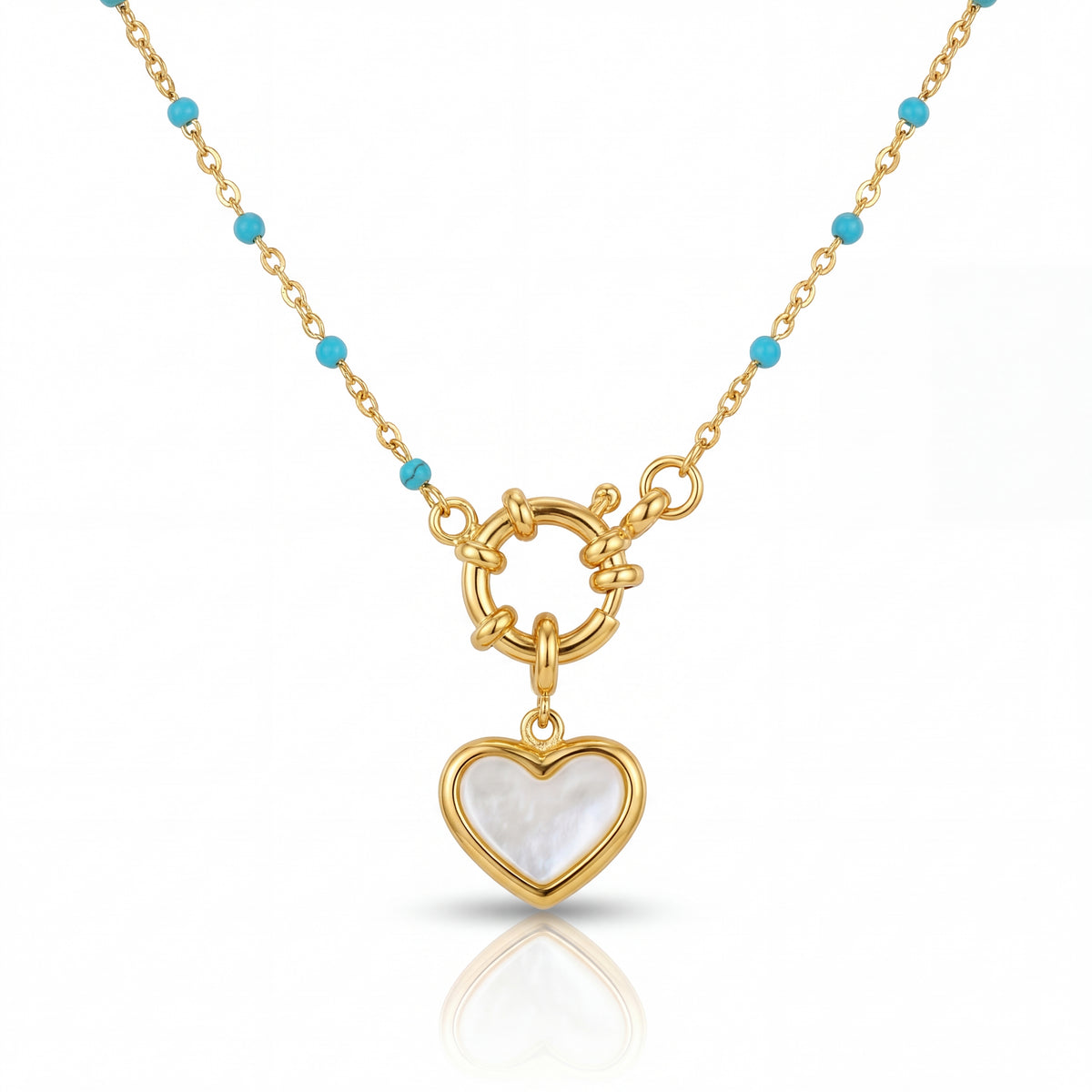 Gold necklace with a heart-shaped pendant on a white background