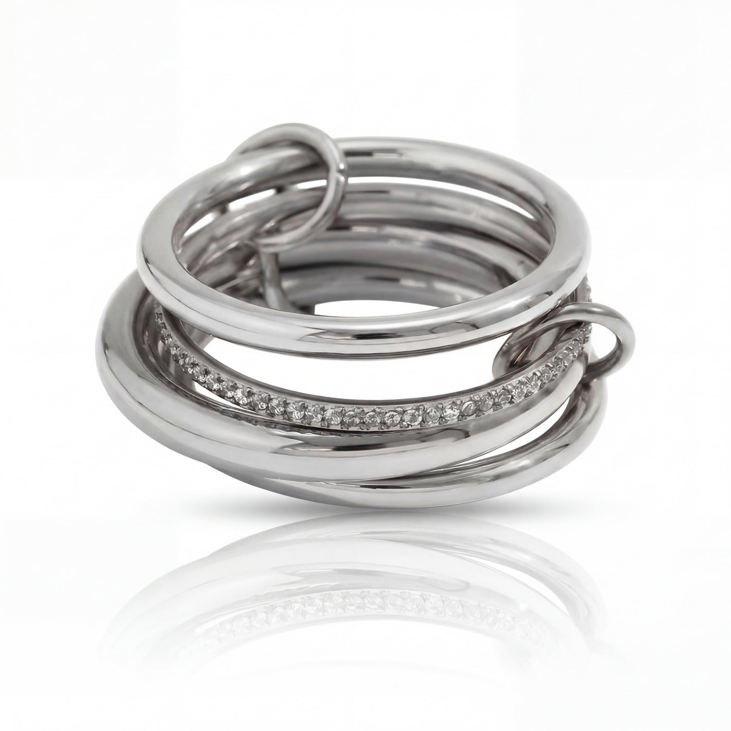 Set of silver rings with diamond accents on a white background