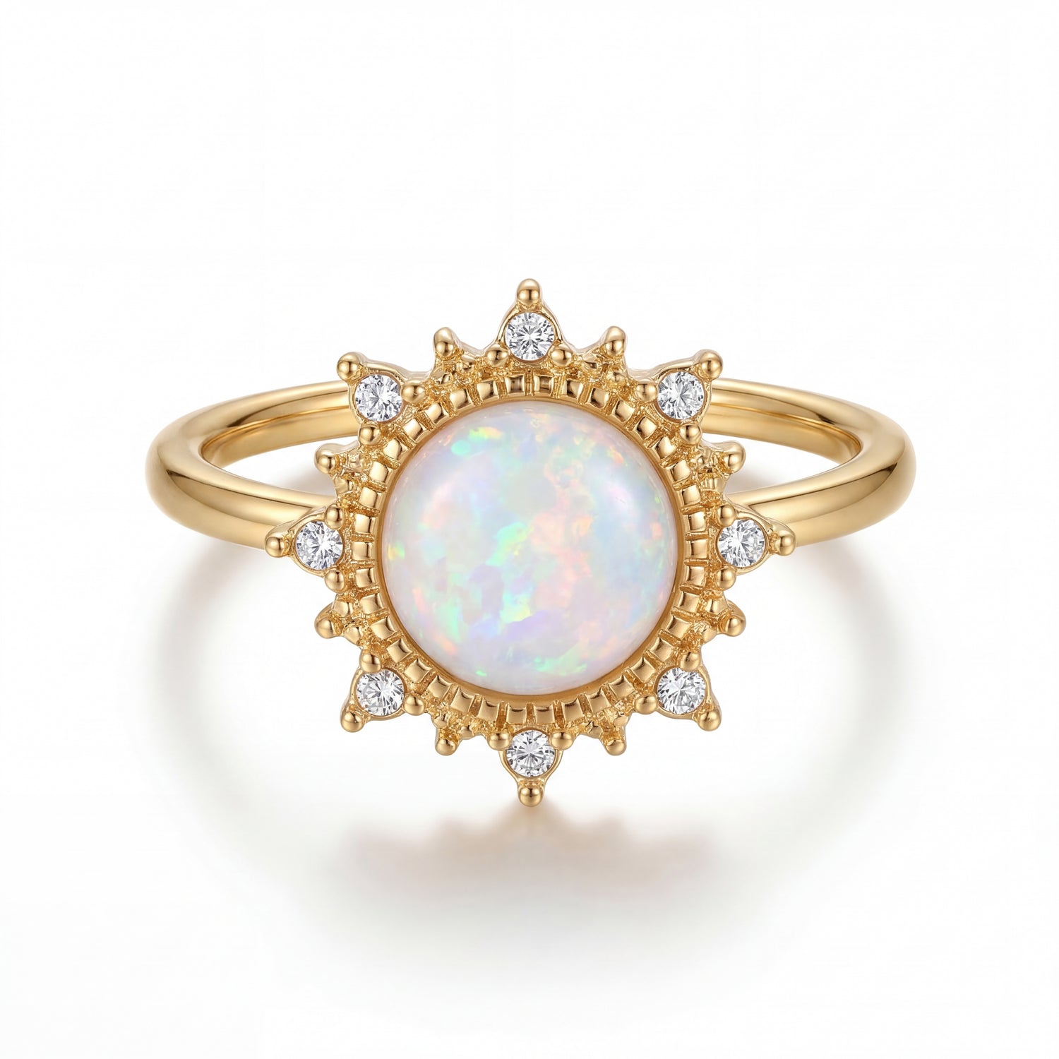 Gold ring with a central opal stone and diamond accents on a white background