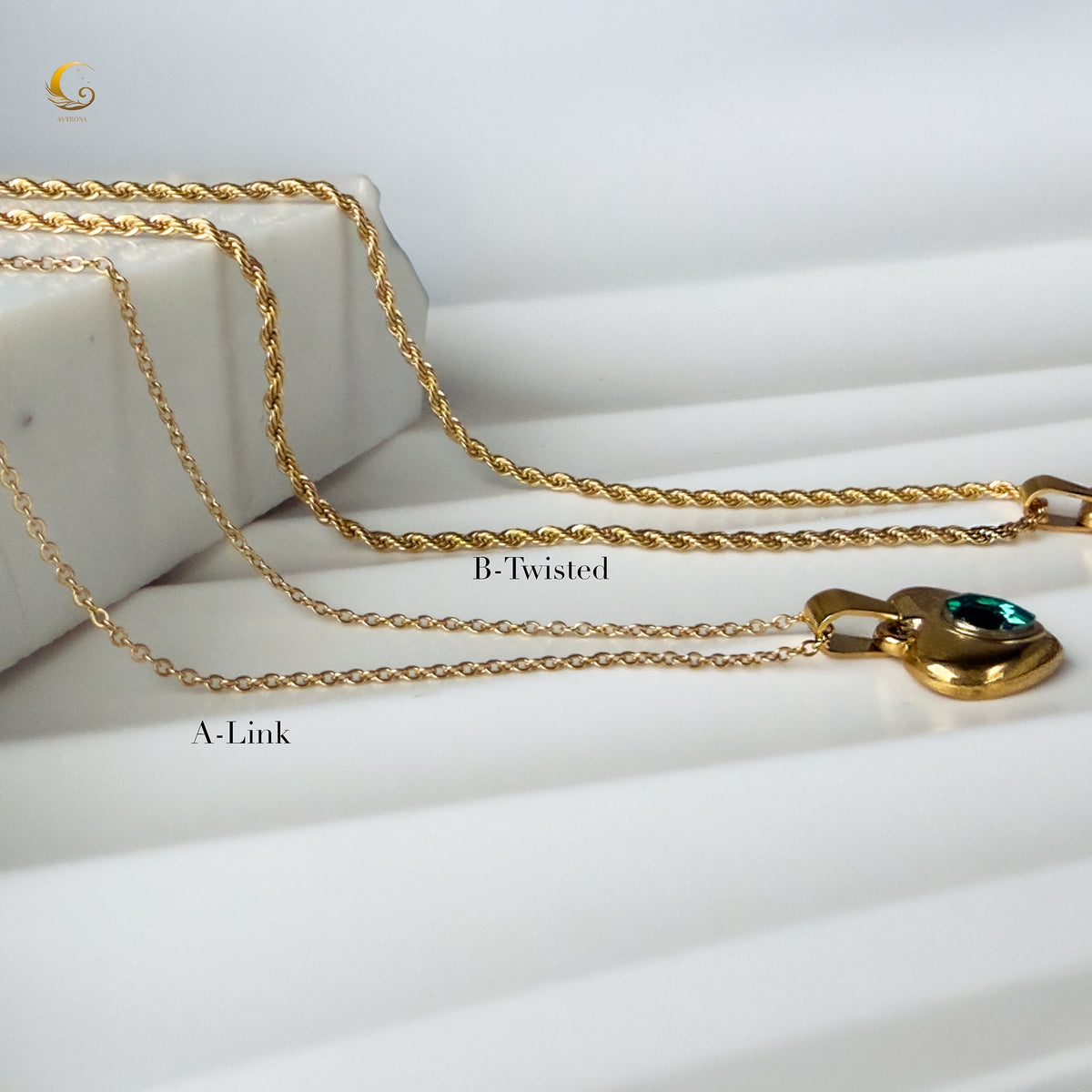 Two necklace chain options, A-Link and B-Twisted, displayed with the emerald heart pendant