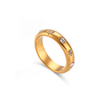 Single Celestial Glow ring photographed on white background showing full engravings