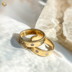 Statement gold band ring with star engravings and shine