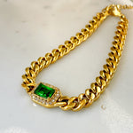 Full view of Harper Bracelet with green crystal centerpiece styled in a perfect circle on soft background.