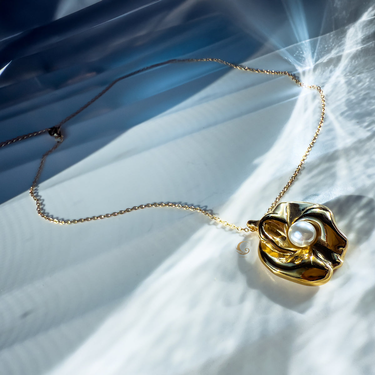 Overhead view of the Nymira necklace, highlighting texture and light play