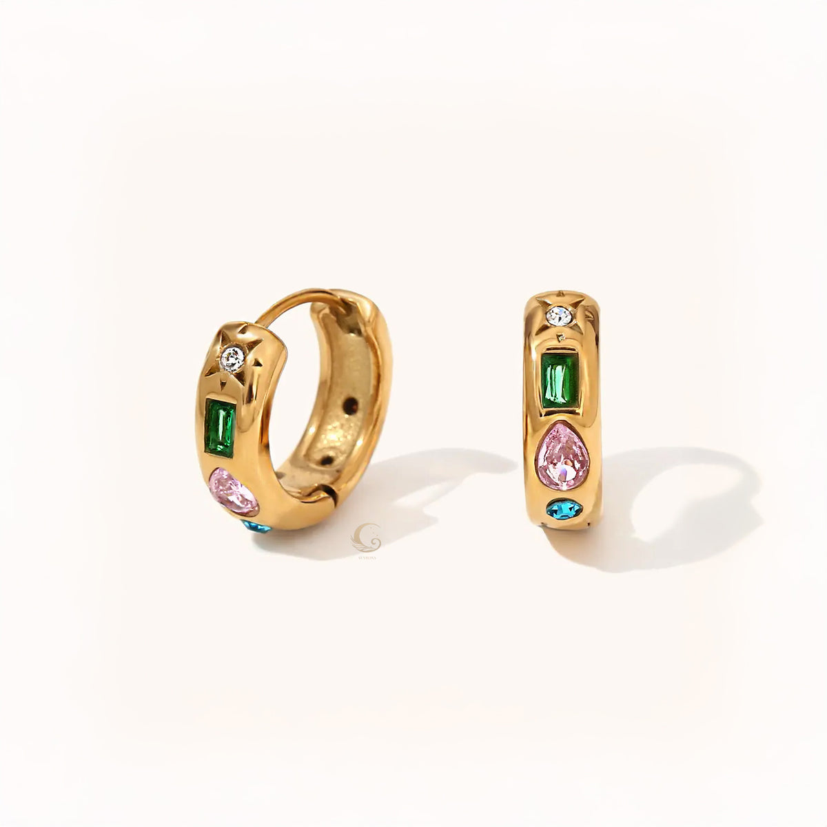 Pair of gold hoop earrings with baguette green, pear pink, round white, and blue stones arranged in a vertical line.